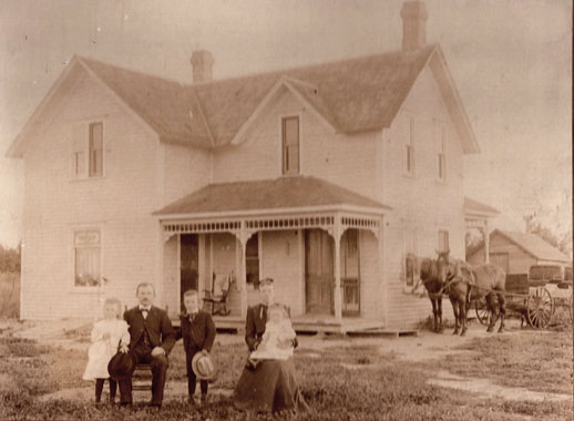 Anton's family in front of their house