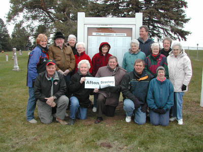 Afton DAR Poses in Front of Cemetery Directory